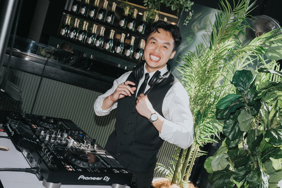 DJ Anthony smiling behind his Pioneer DJ controller